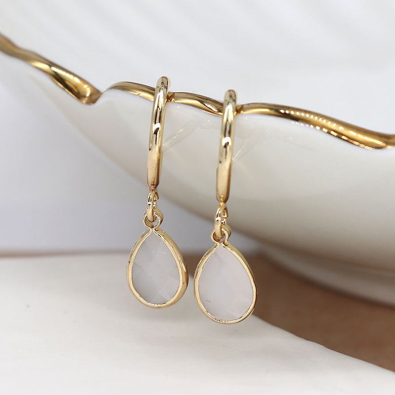 Golden hoop and white crystal drop earrings