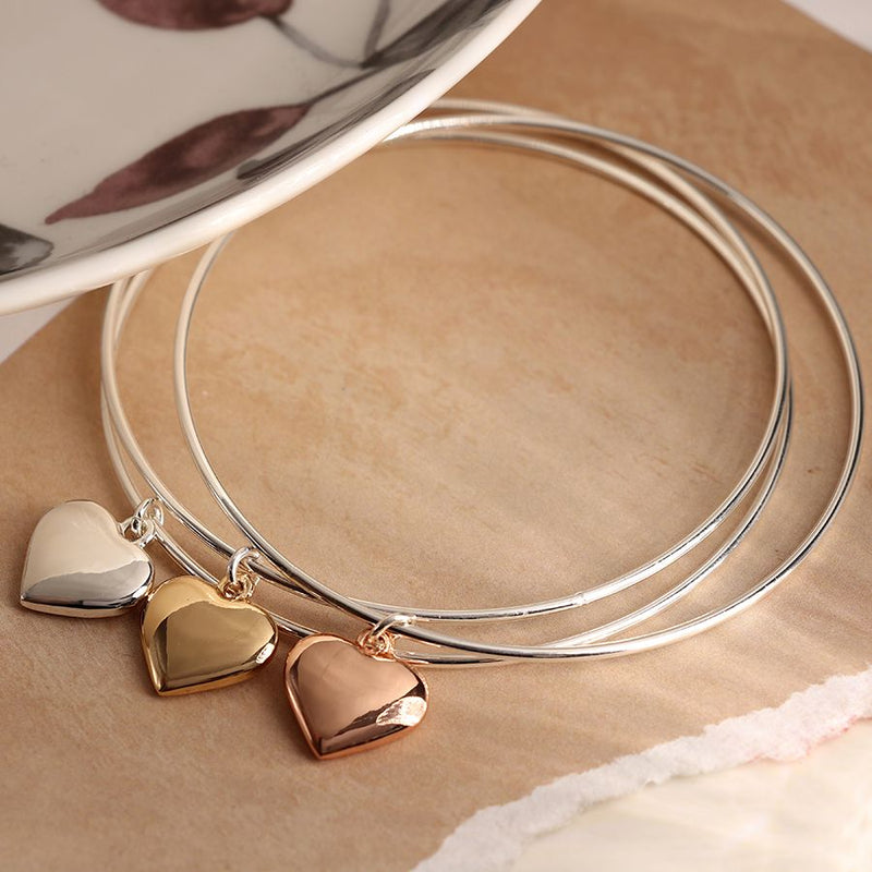 Silver plated triple bangle with large mixed metallic hearts