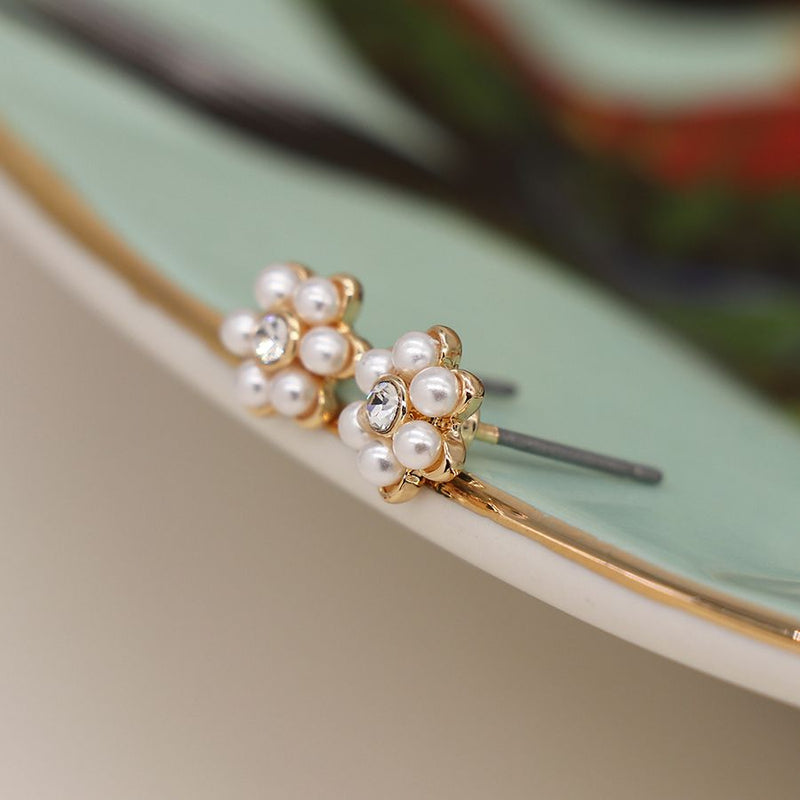 Faux gold plated pearl and crystal flower studs