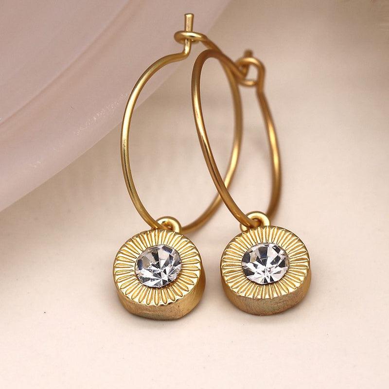 Golden wire hoop and embossed crystal drop earrings