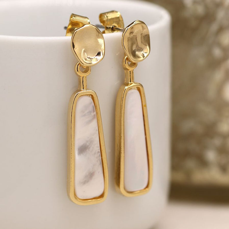 Golden organic disc and shell drop earrings