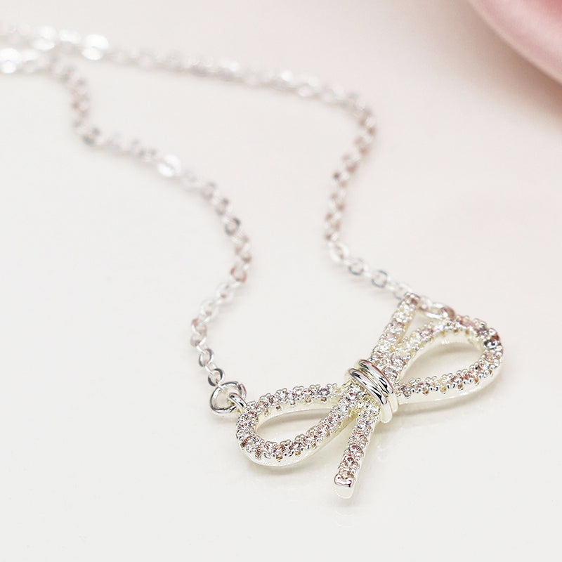 Silver plated gift bow necklace with crystals