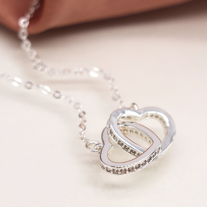 Silver plated crystal edged linked hearts necklace