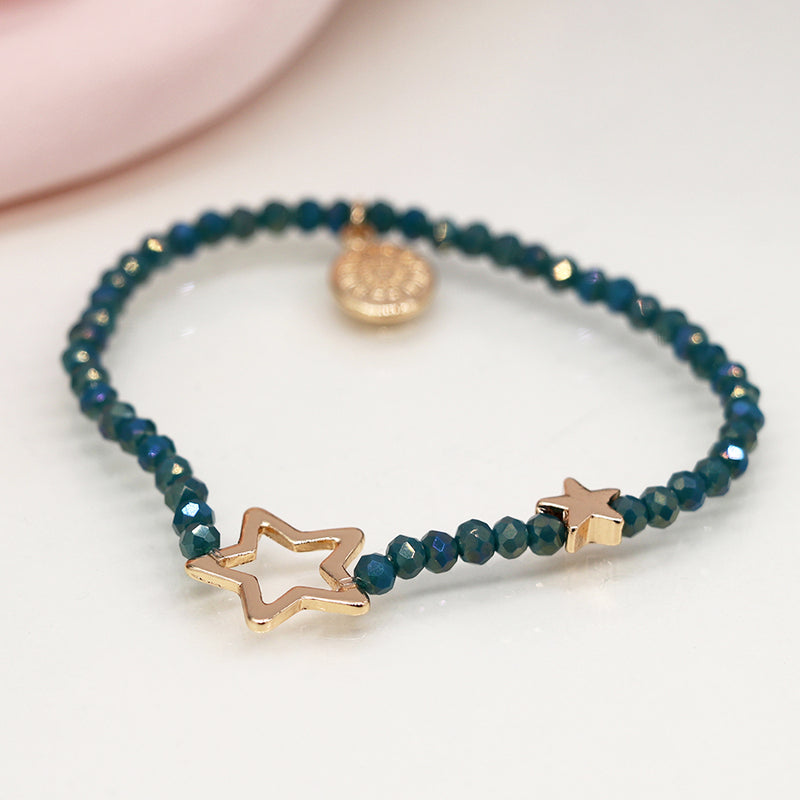 DUSKY BLUE BEAD BRACELET WITH FAUX GOLD SOLID AND OPEN STARS