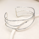Silver plated hammered triple wave strand bangle