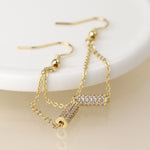 Golden crystal cylinder and chain earrings