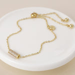 Golden crystal cylinder bracelet