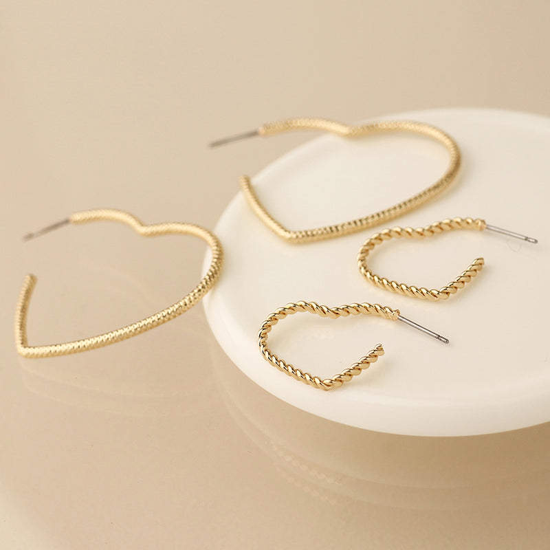 Golden mixed size textured heart earrings