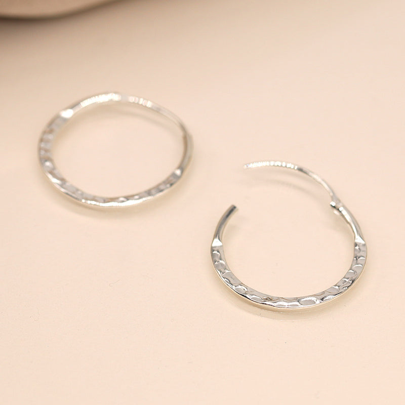 Sterling silver flat hammered hoop earrings