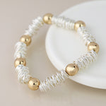 Silver plated spun yarn and golden bead bracelet