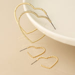 Golden mixed size textured heart earrings