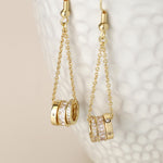 Golden triple crystal rings and chain earrings