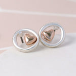 Silver plated stud earrings with a little rose gold heart