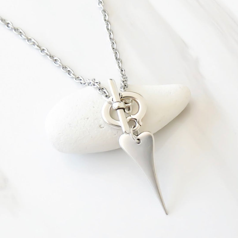 Fine oval chain t-bar necklace with a mini pointed heart charm.
