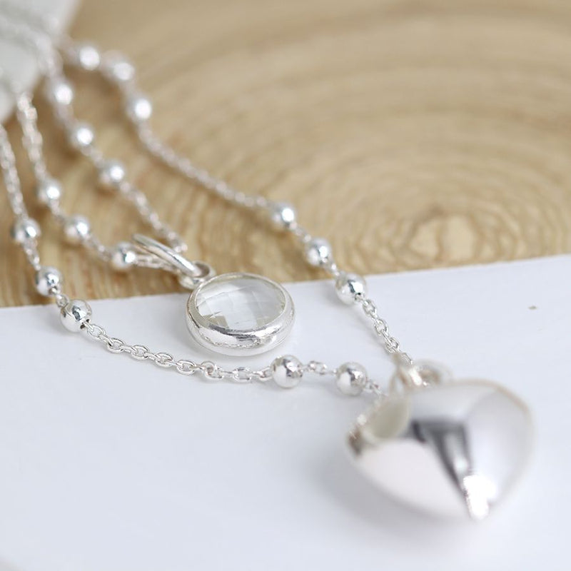 Silver plated layered crystal and puffed heart necklace