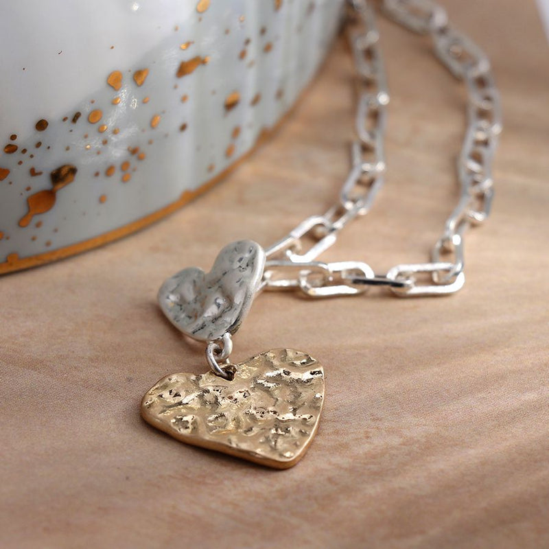 Silver link necklace with silver and gold beaten hearts