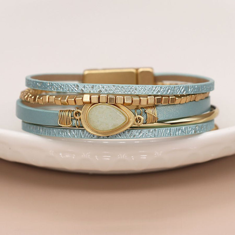 Aqua leather and golden bracelet with aqua teardrop stone