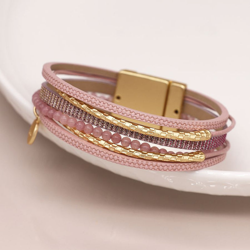 Pink leather bracelet with pink beads and golden elements