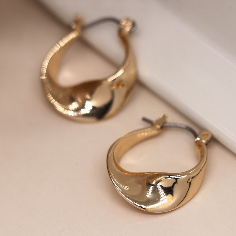 Golden smooth twisted hoop earrings