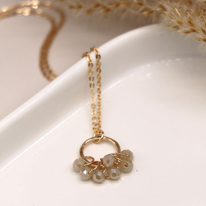 Golden hoop necklace with crystal bead clusters