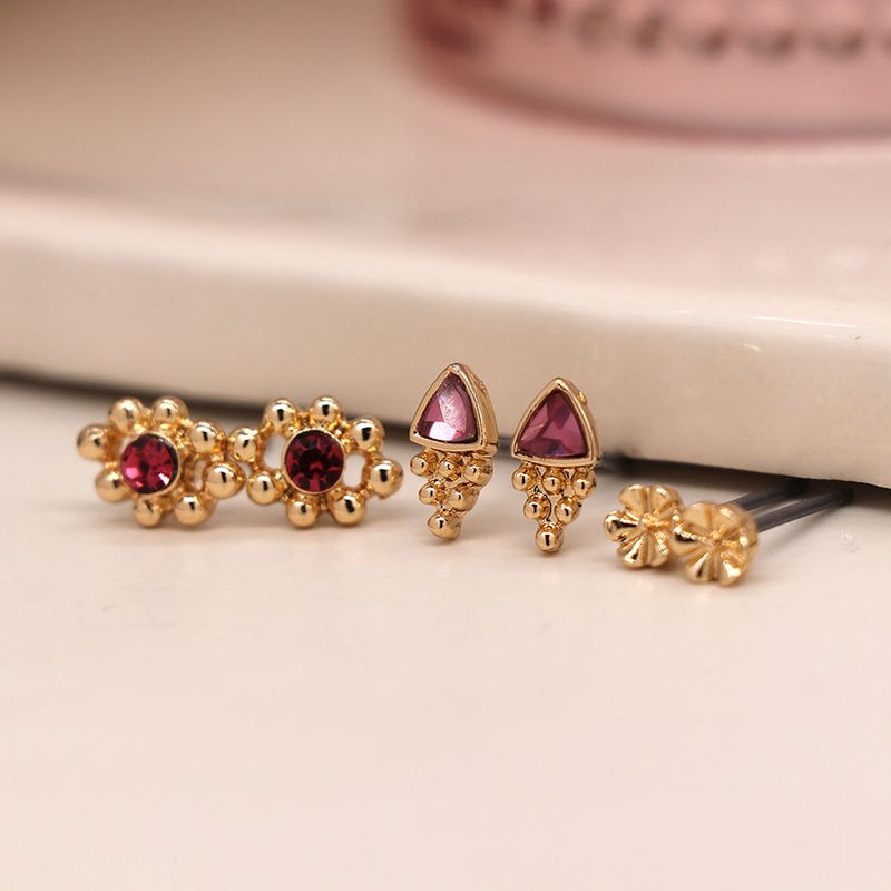 Faux gold plated triple stud set with pink crystal