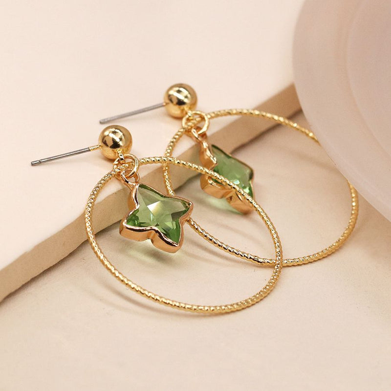 Golden textured hoop and green crystal earrings