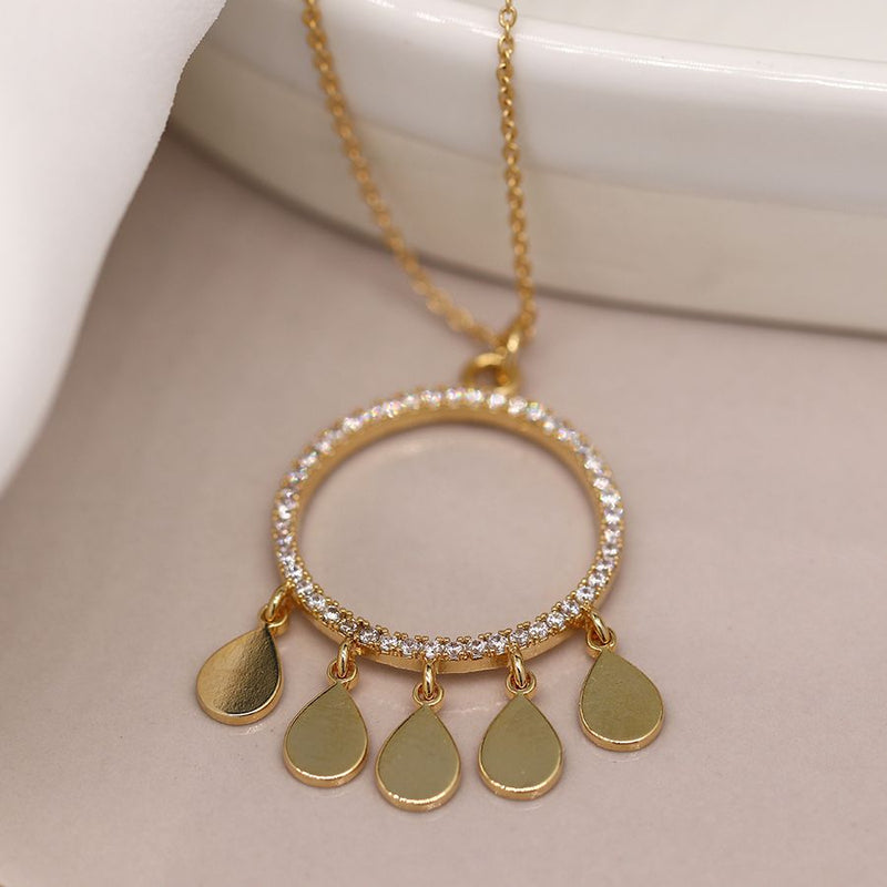 Golden crystal inset circle and multi teardrop necklace