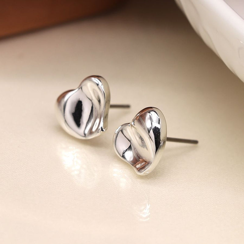 Silver wavy surface heart stud earrings