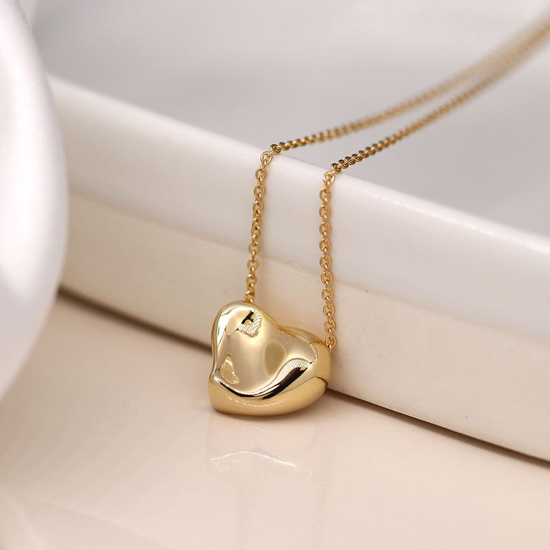 Golden wavy surface heart necklace