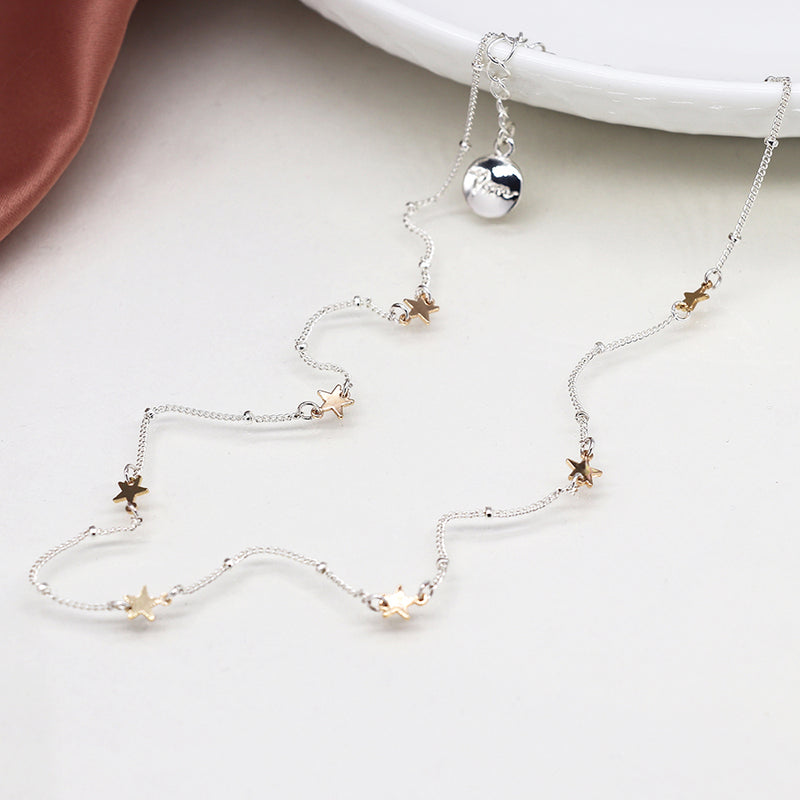 Silver plated station chain and faux gold stars necklace