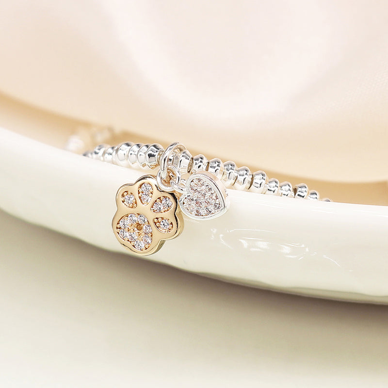 SILVER PLATED BEAD BRACELET WITH FAUX GOLD PAWPRINT AND SP HEART