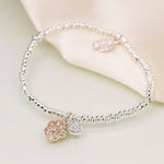 SILVER PLATED BEAD BRACELET WITH FAUX GOLD PAWPRINT AND SP HEART