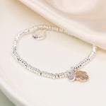SILVER PLATED BEAD BRACELET WITH FAUX GOLD PAWPRINT AND SP HEART