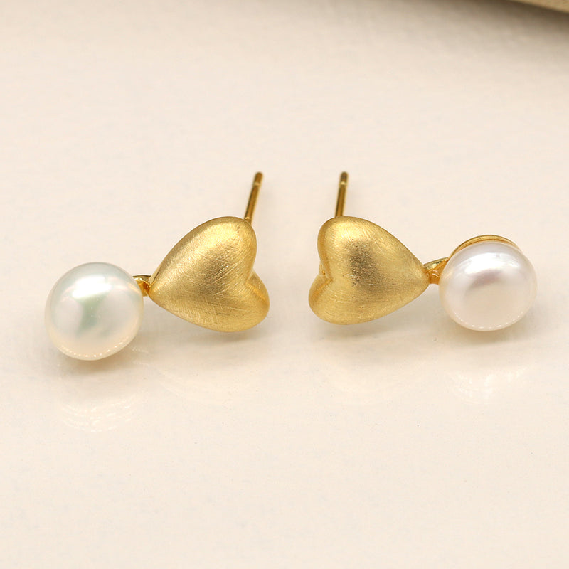 Golden brushed heart and pearl stud earrings