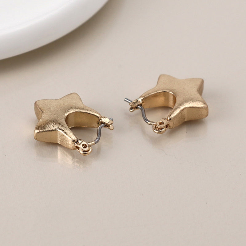 Golden worn chunky heart earrings