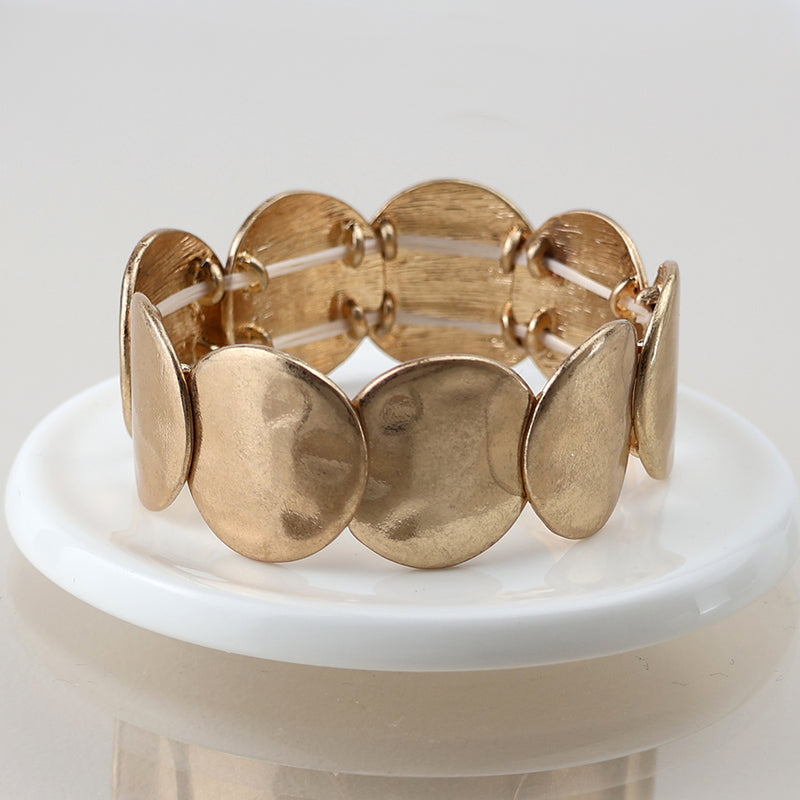 Golden worn disc stretch bracelet