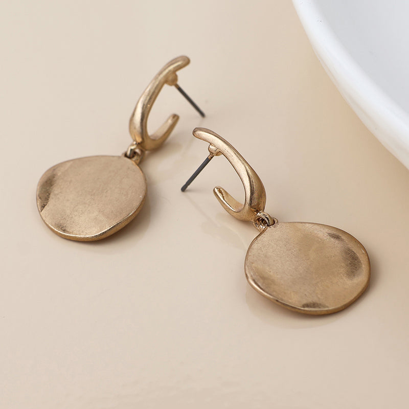 Golden worn disc drop earrings
