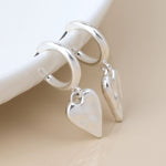 WORN SILVER BEATEN HEART DROP C POST EARRINGS