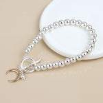 Silver plated bead, little sun and gold moon charm bracelet