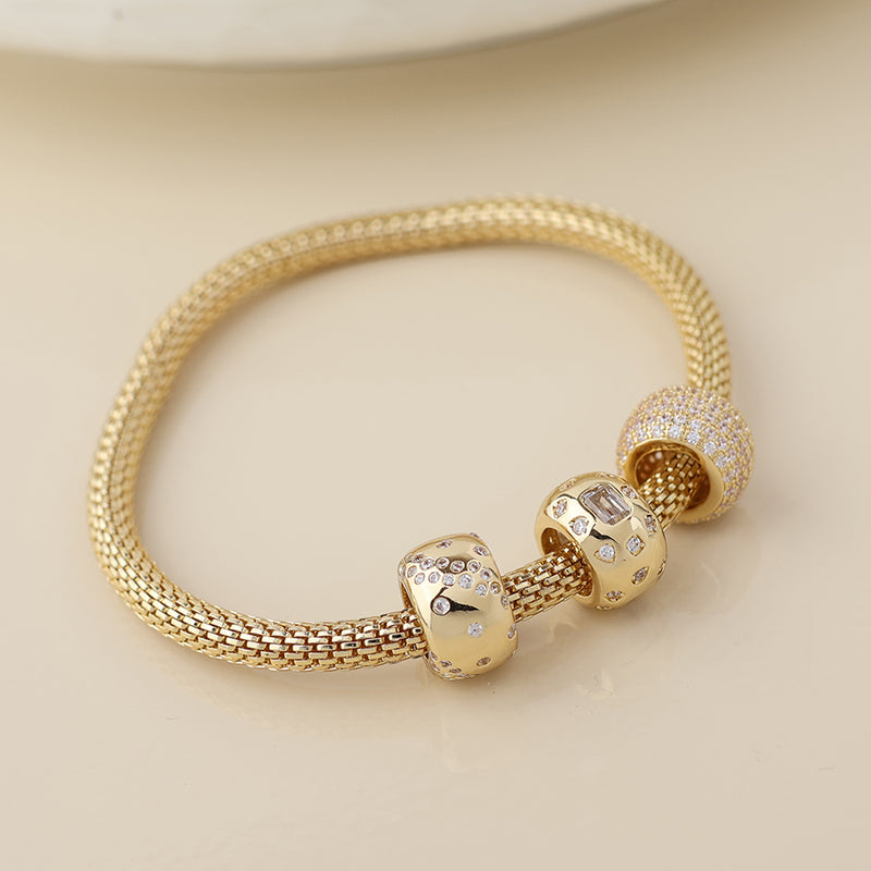 Golden mesh and crystal triple ring bracelet