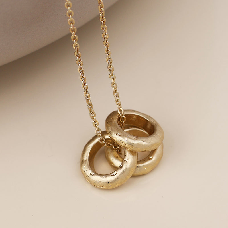 MOLTEN TRIPLE RING NECKLACE-WORN GOLD