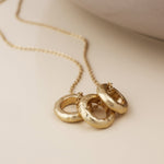 MOLTEN TRIPLE RING NECKLACE-WORN GOLD