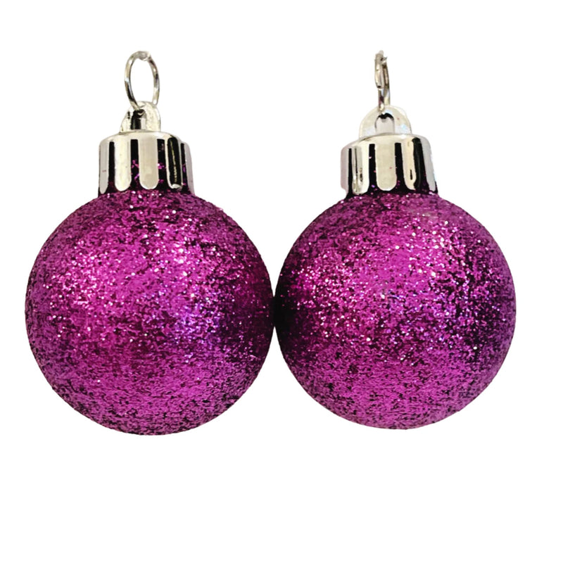 Tube of ten small fushia glitter baubles