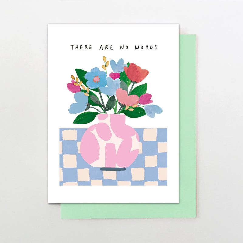 There are now words vase of flowers