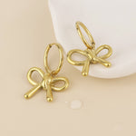 BELLE BOW HUGGIE EARRINGS - GOLD