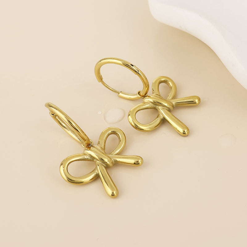 BELLE BOW HUGGIE EARRINGS - GOLD