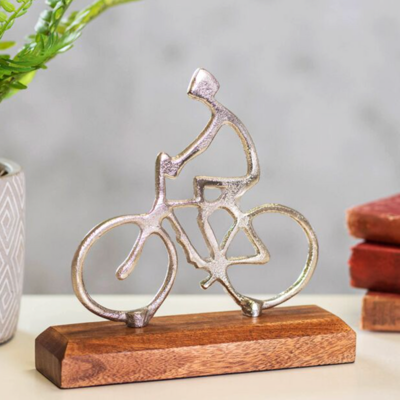 Silvered metal cyclist on base