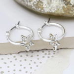 Golden pave stars and silver hoop earrings