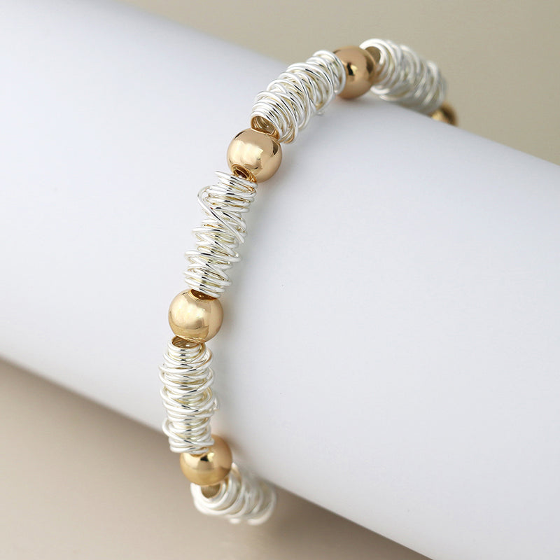 Silver plated spun yarn and golden bead bracelet