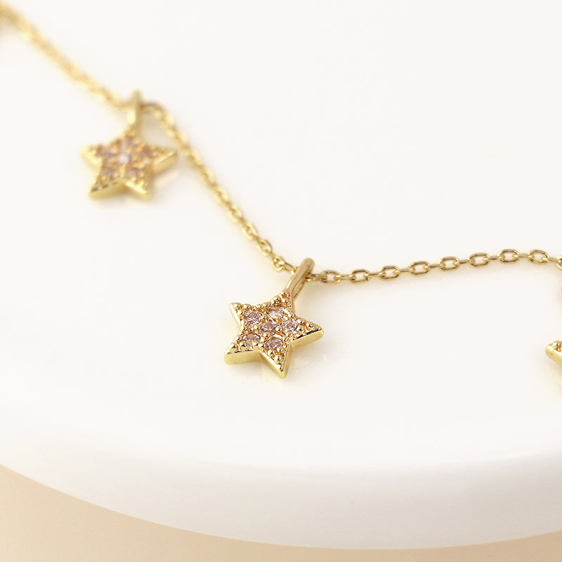 Golden fine chain and crystal star drops necklace